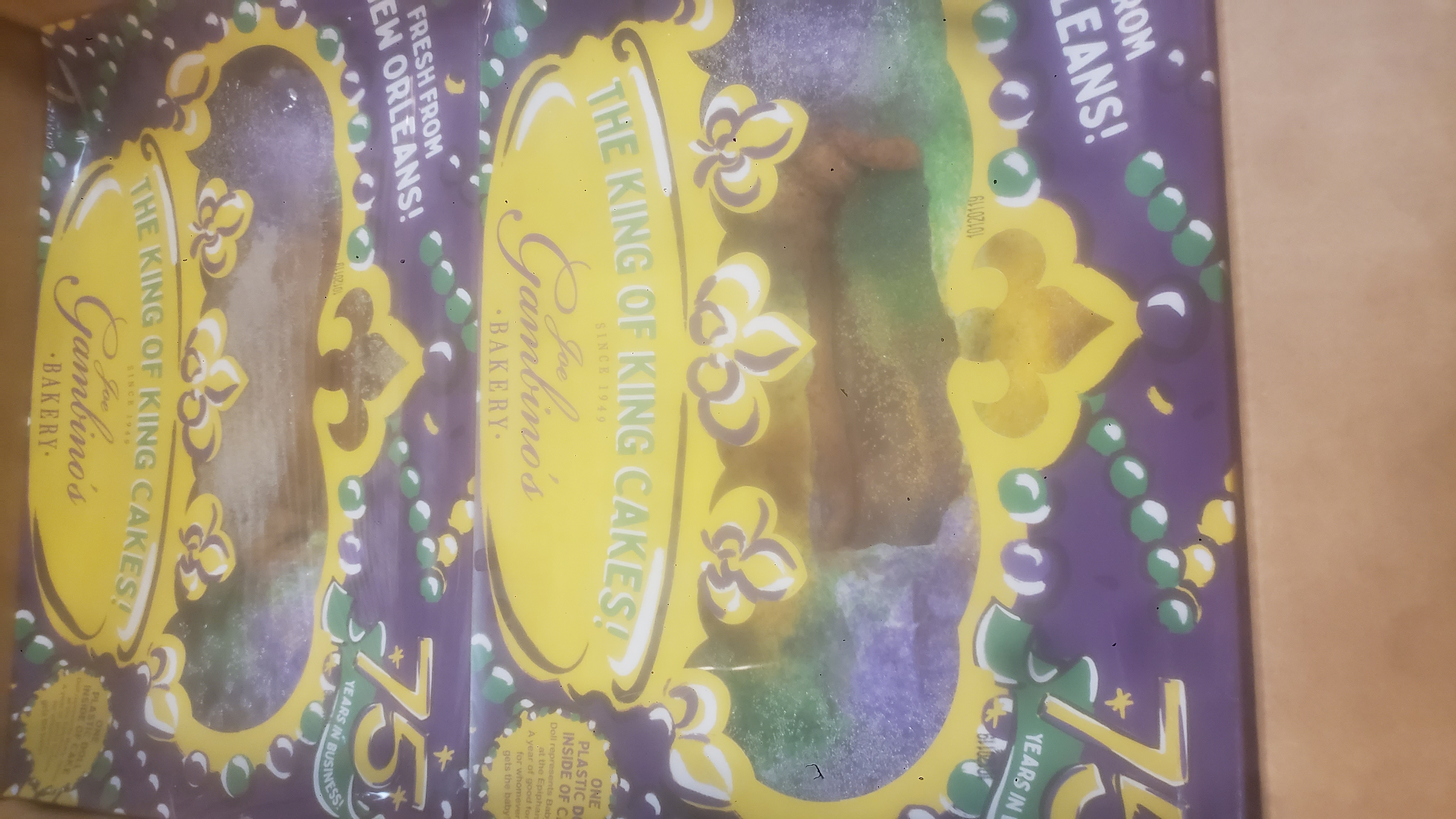 Sheets of king cake in a cardboard box.